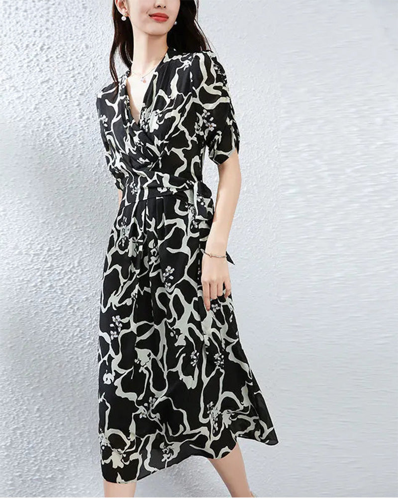 Capturing the dignity of motion: the side profile of the wrap dress as it flows, showing how the waist sashes secure the structure without compromising movement. — From Borcelleclothes.