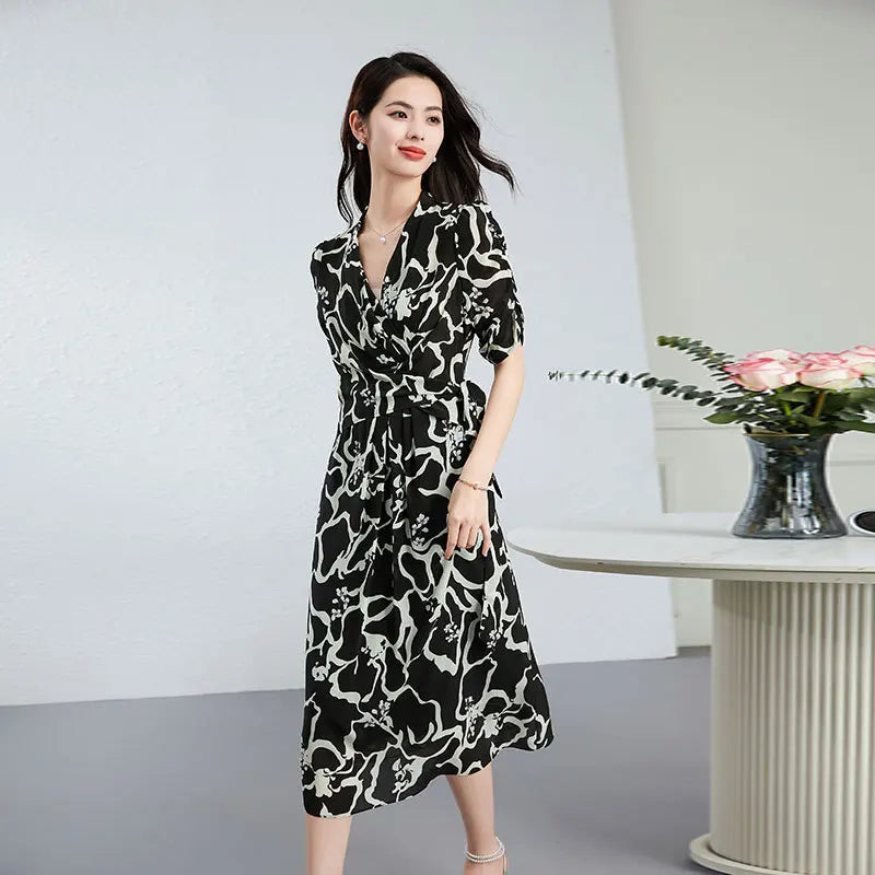 Women's midi-length wrap silk dress in Rorschach Inkblot Test color features a wrap V-neckline, 1/3 sleeves with gathered cuffs, and front box pleats on the skirt. — From Borcelleclothes.