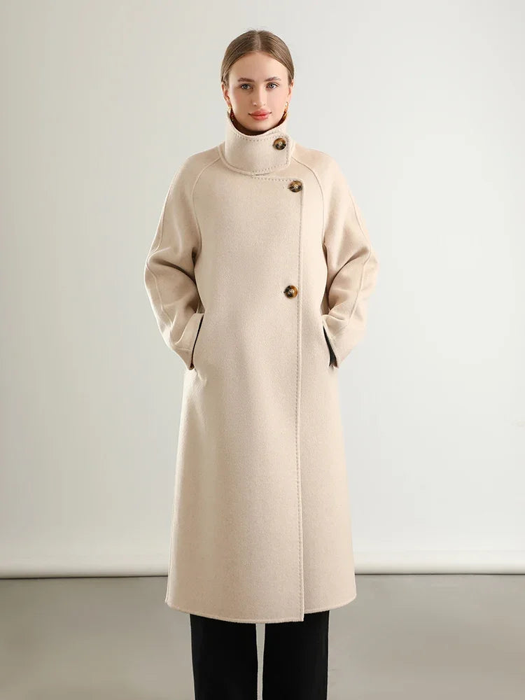 Women's long, wrap-style double-sided wool coat in Ivory Route, with an asymmetrical silhouette, saddle sleeves, and a high stand-up collar. — From Borcelleclothes.