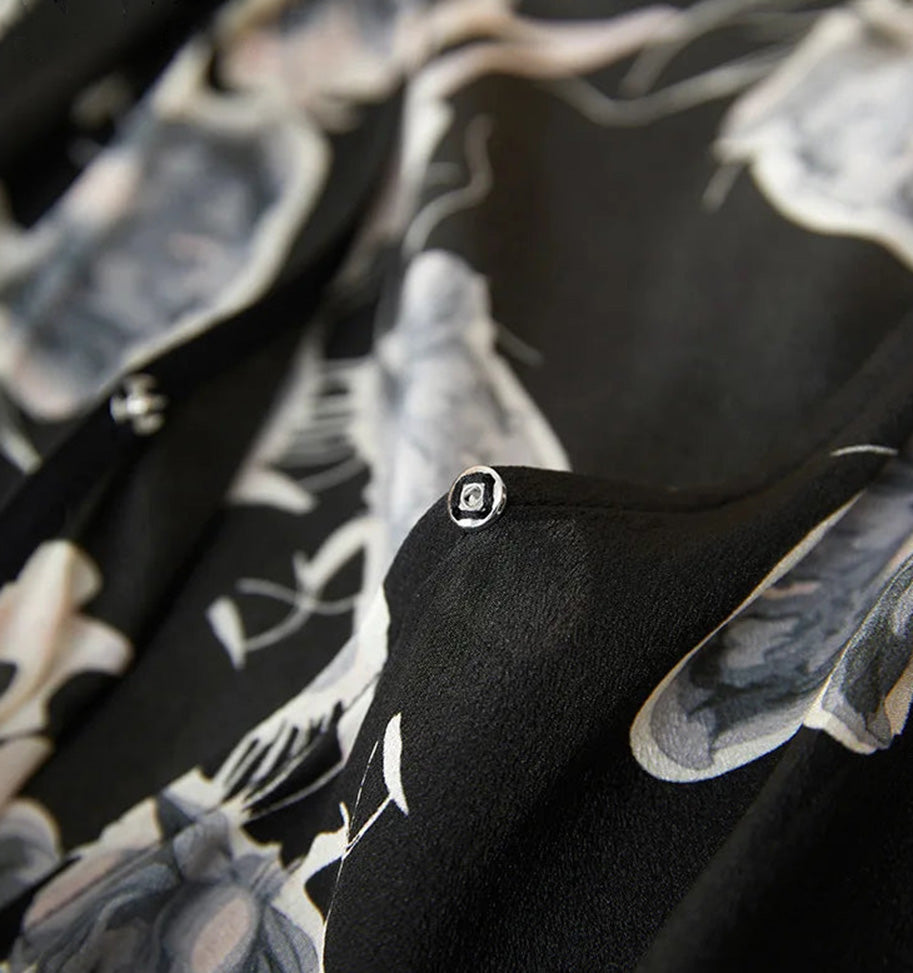 Close-up of the concealed snap fastener on the V-neckline for a secure and discreet fit — From Borcelleclothes.