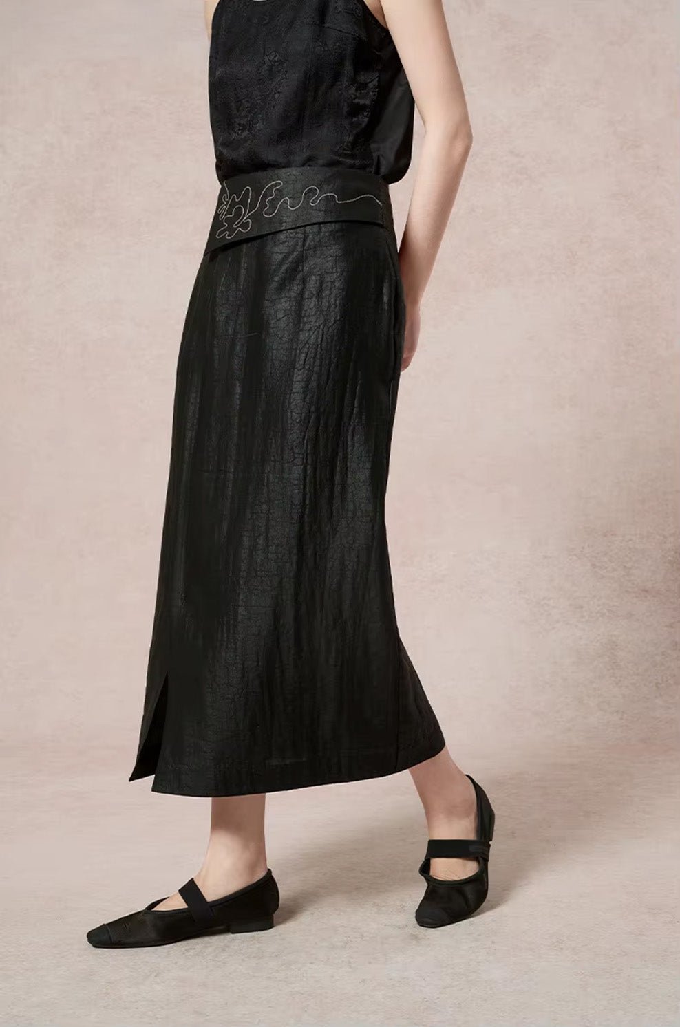 Side profile dynamic shot of a model walking, showcasing the functional walking vent of the unstitched front placket — From Borcelleclothes.