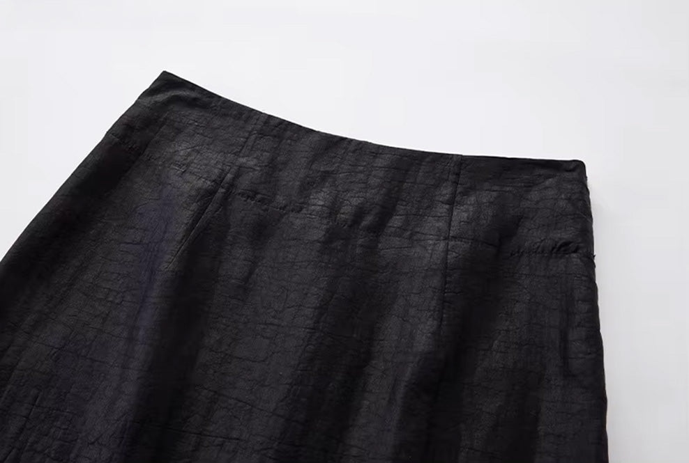 Close-up of the back waist construction showing the clean-faced edge finishing and precise stitching — From Borcelleclothes.