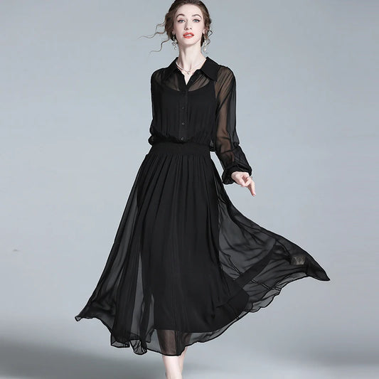 Women's 6A Grade Mulberry silk georgette dress in Onyx with pointed collar, ribbed waist detail, and flowing mid-calf skirt—structured above, free below. From Borcelleclothes. 