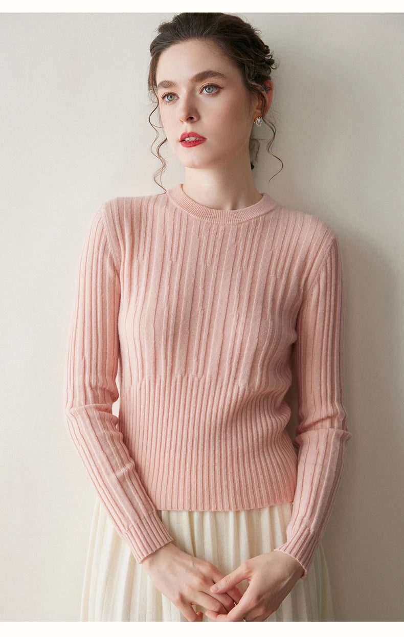Model in Pastel Pink abstract-striped sweater with hands gently posed — From Borcelleclothes.
