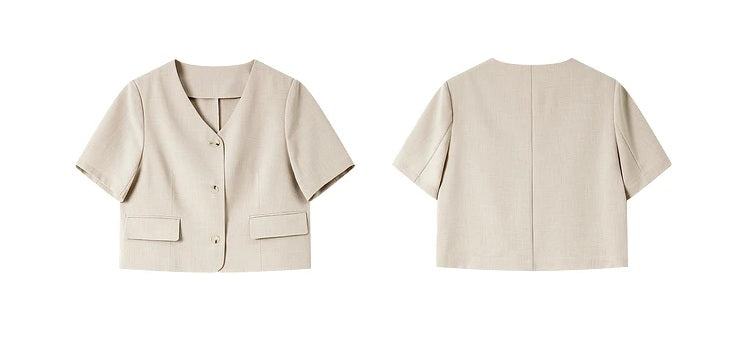 Front and back views of the cropped short-sleeve jacket from the alabaster set. From Borcelleclothes.