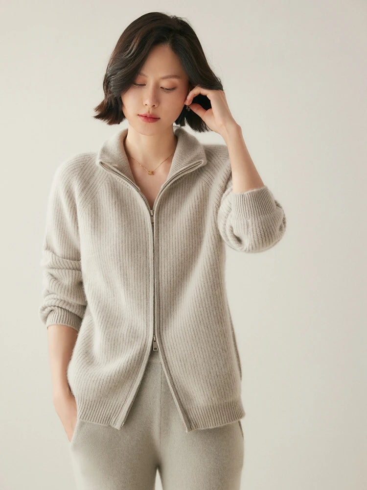 Model in Pale Silver Alashan cashmere cardigan gently touching hair — From Borcelleclothes.