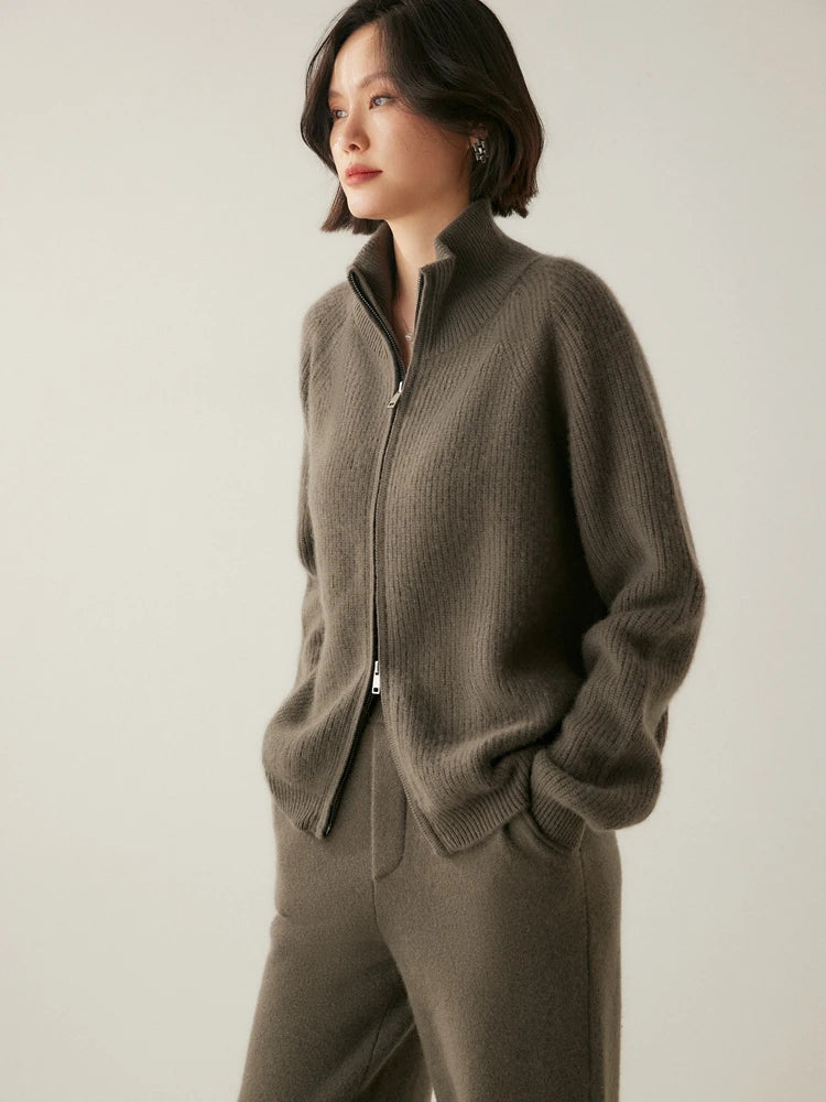 Model turned slightly to the side in Umber Alashan cashmere cardigan — From Borcelleclothes.