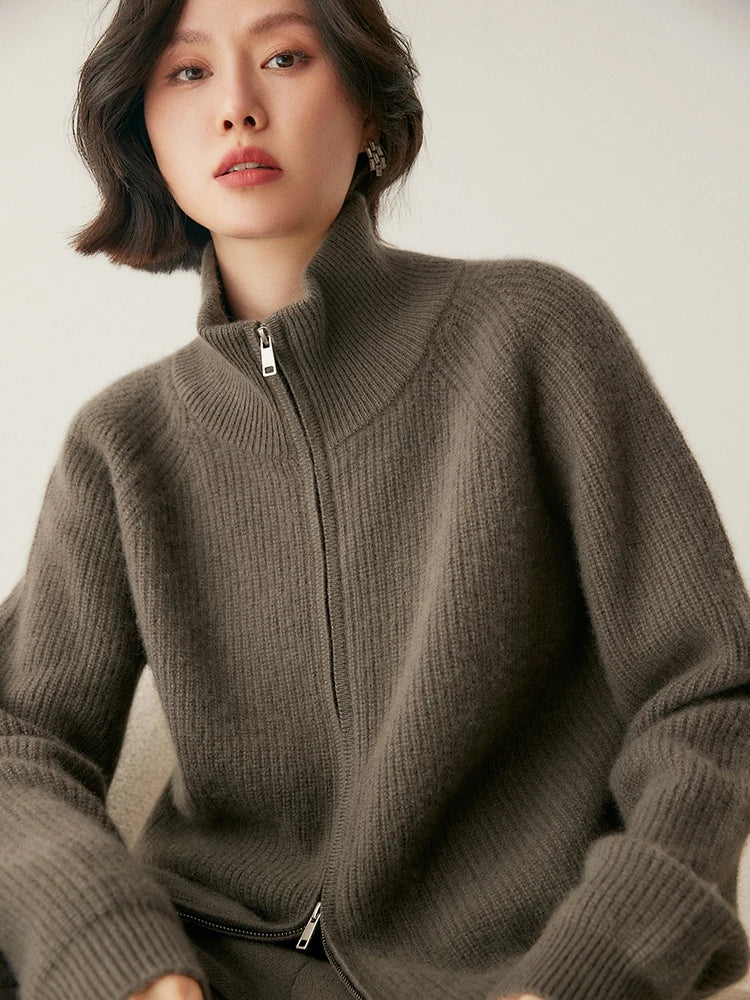 Model sitting in Umber Alashan cashmere cardigan — From Borcelleclothes.