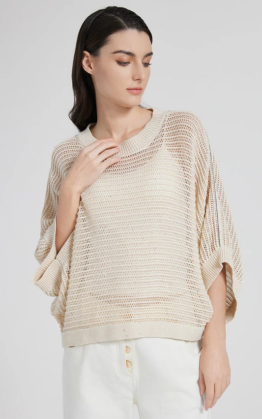 Close view of woman gently touching the wide ribbed neckline of the Spring Wood linen mesh top. From Borcelleclothes.