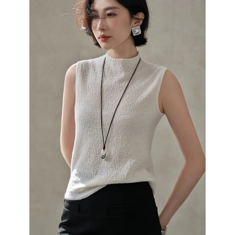 Model in Pearl Bush bouclé cashmere top, turned slightly to the side to show neckline and structure — From Borcelleclothes.