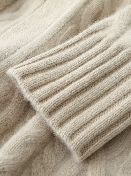 The cuff of the women's Cable-Knit Cashmere Wool Coat in Pearl Bush, showcasing the ribbed texture and refined craftsmanship, Borcelleclothes.
