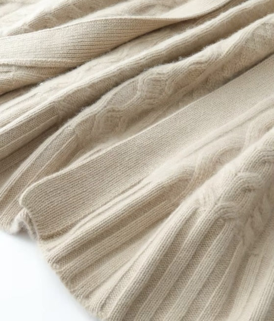 Detailed view of the front plackets and wrong side of the bottom hem on the women's Cable-Knit Cashmere Wool Coat in Pearl Bush, highlighting the meticulous craftsmanship, Borcelleclothes.