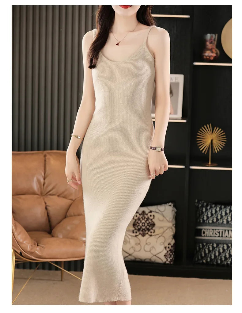 Woman in a Soft Amber wool camisole dress, one leg slightly bent as she stands with quiet grace and warmth. From Borcelleclothes.