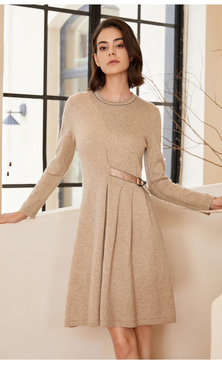 Woman in Dark Vanilla dress resting hand on staircase — From Borcelleclothes.