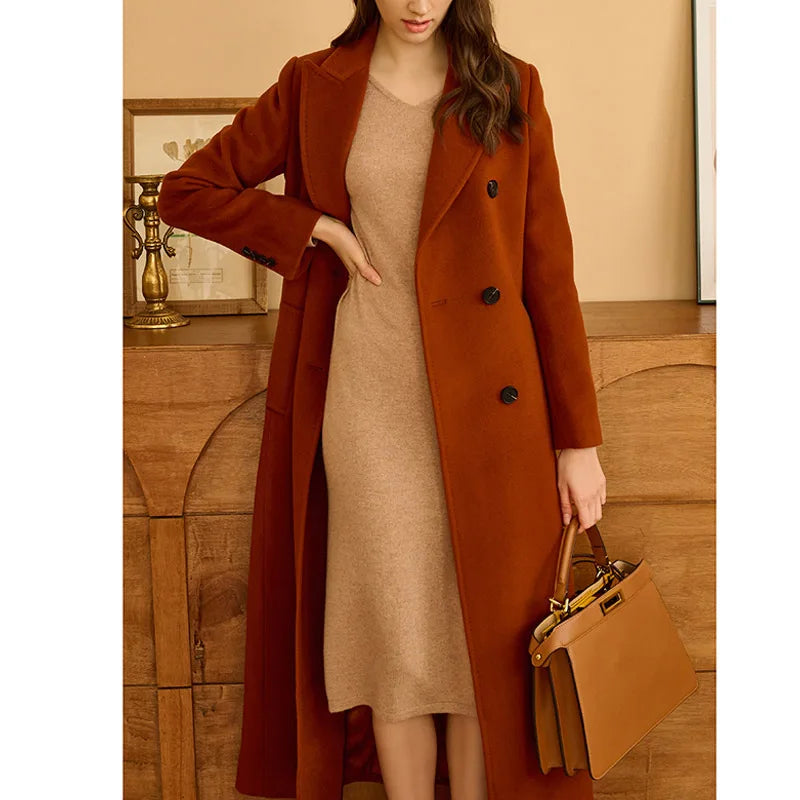 Women's Cashmere Blend Long Coat in Rust Brown, featuring a minimalist double-breasted front, princess seamings at the back, and a center back vent, crafted from a luxurious blend of Mongolian cashmere and high-count wool for modern elegance and comfort.  From Borcelleclothes.  