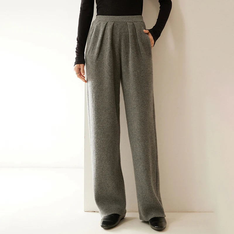 Model with hand in pocket wearing Flint pleated cashmere trousers — From Borcelleclothes.