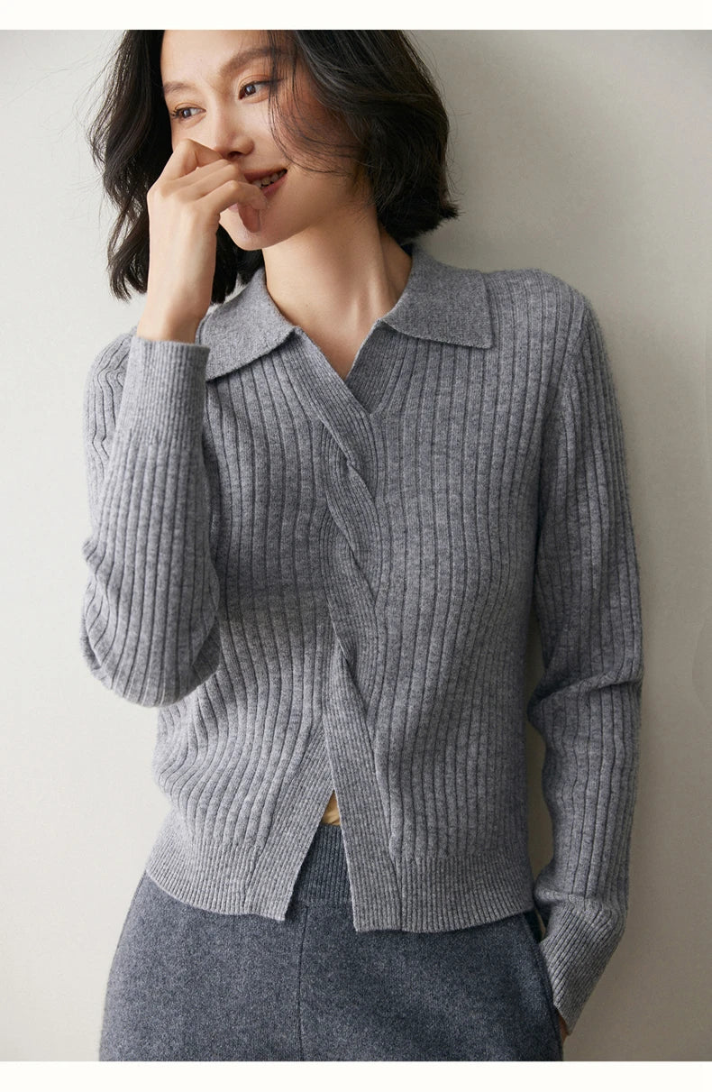 Smiling model touching lips in women’s cashmere rib sweater in Oslo Grey — From Borcelleclothes.