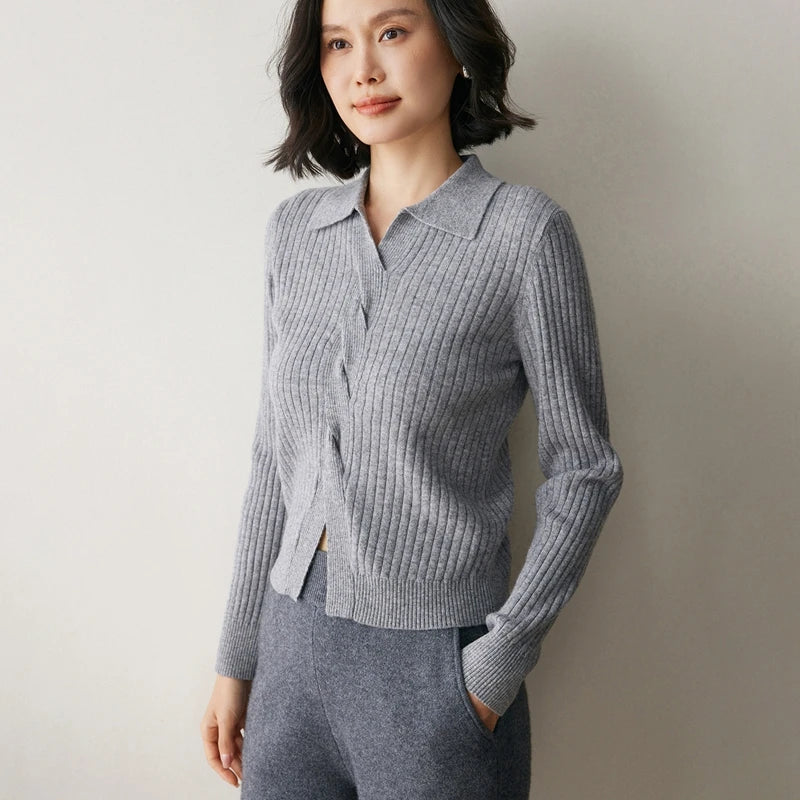Women’s cashmere sweater in Oslo Grey, featuring a graphic 4×2 rib, polo-style collar, and braided front detail — From Borcelleclothes.