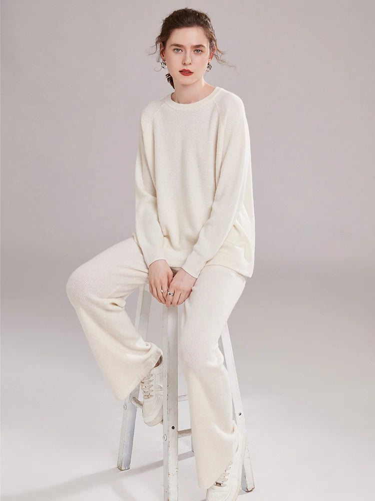 Women’s cashmere set in diagonal knit texture with relaxed sweater and straight-leg pants — shown in color White Coffee. From Borcelleclothes.
