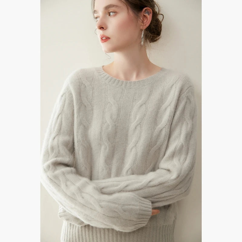 Women's cashmere set with two-strand cables in Cloud, model with arms crossed — From Borcelleclothes.