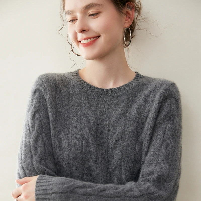 Women's cashmere set with two-strand cables in Davy Grey, upper part of model with crossed arms — From Borcelleclothes.