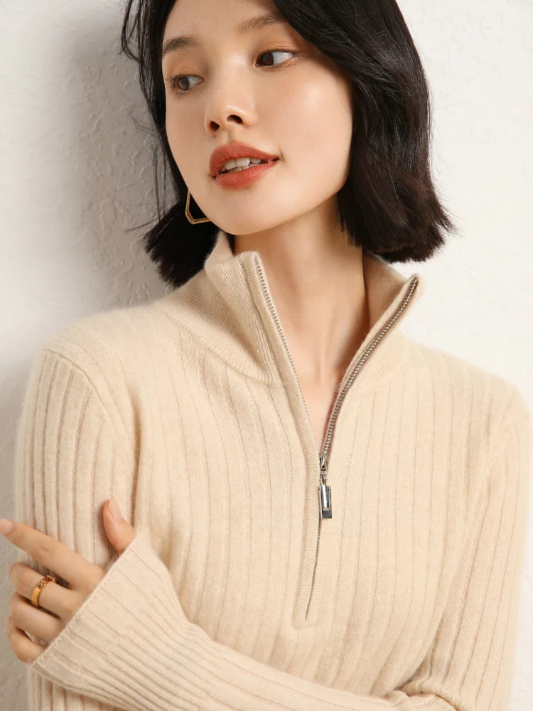 Model resting hand on arm in cashmere sweater in shifting ribs, Almond — From Borcelleclothes.