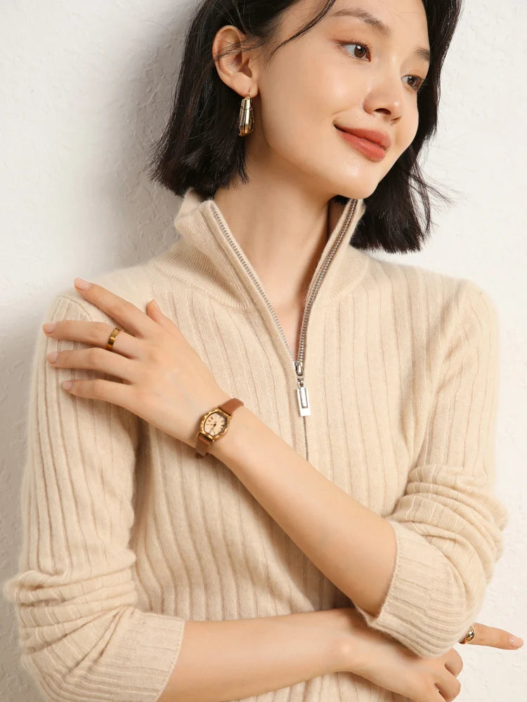 Model resting hand on shoulder in cashmere sweater in shifting ribs, Almond — From Borcelleclothes.