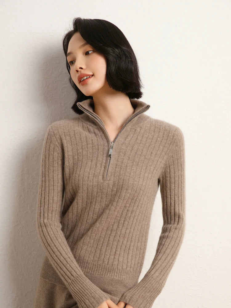 Model with hands resting on leg in cashmere sweater in shifting ribs, Pale Taupe — From Borcelleclothes.