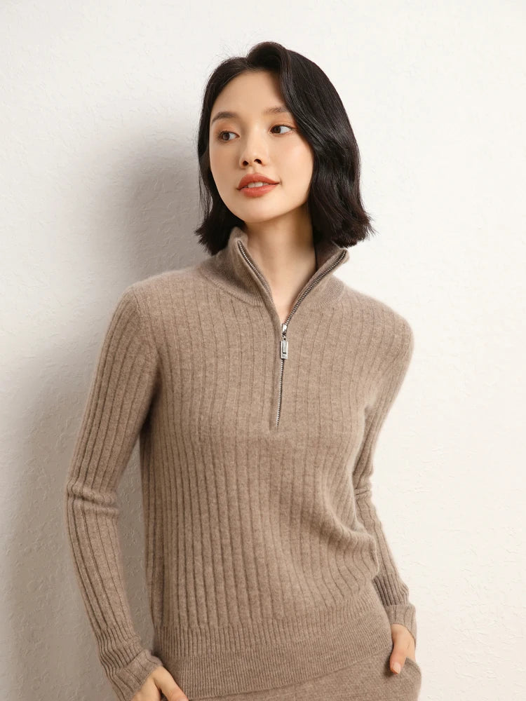 Model with hands in pants pockets wearing cashmere sweater in shifting ribs, Pale Taupe — From Borcelleclothes.