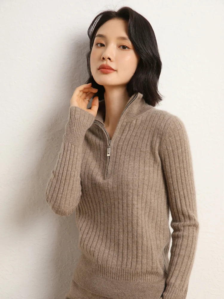 Model touching hair in cashmere sweater in shifting ribs, Pale Taupe — From Borcelleclothes.