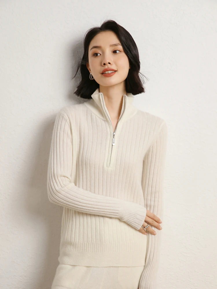 Model touching arm in cashmere sweater in shifting ribs, Pearl Bush — From Borcelleclothes.