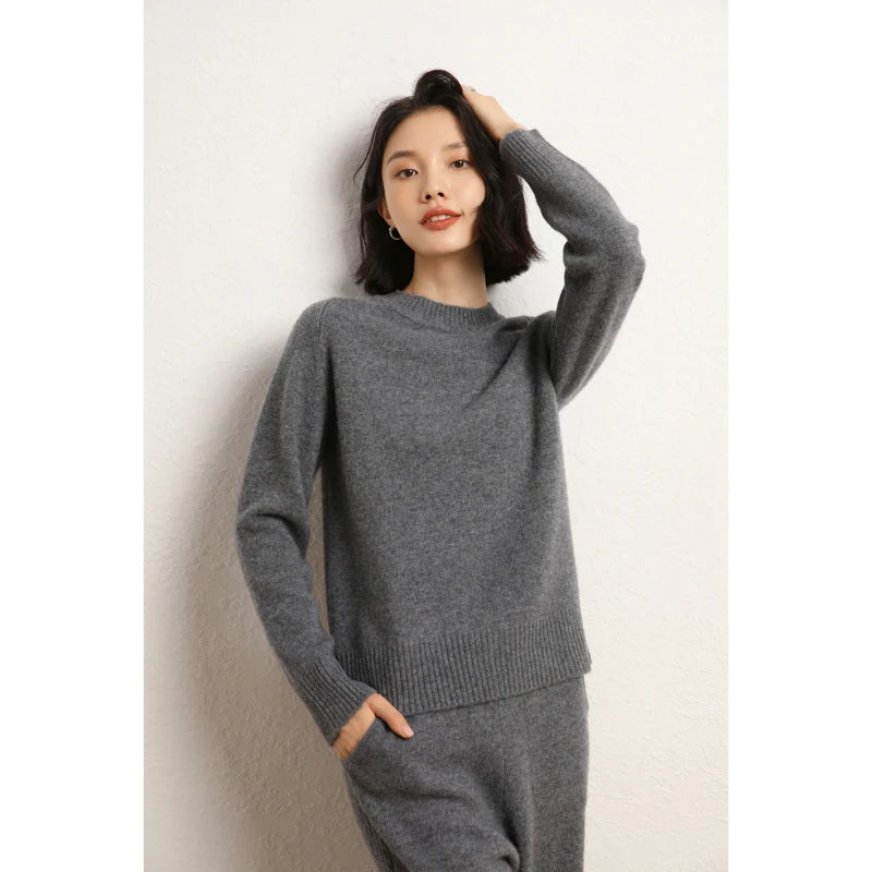 Women’s slim-fit sweater in 100% Alashan cashmere with saddle sleeves, ribbed crew neck, and 2x2 ribbed cuffs and hem, shown in Dove Grey color — From Borcelleclothes.