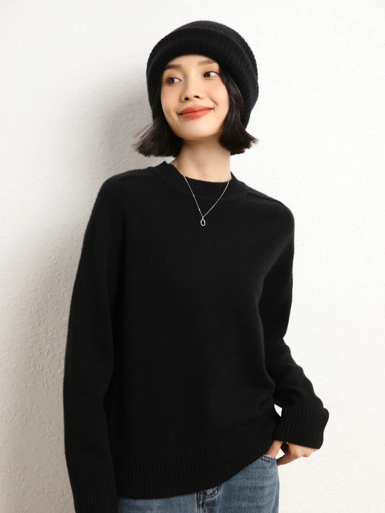 Smiling woman in Onyx cashmere sweater looking to the side – From Borcelleclothes.