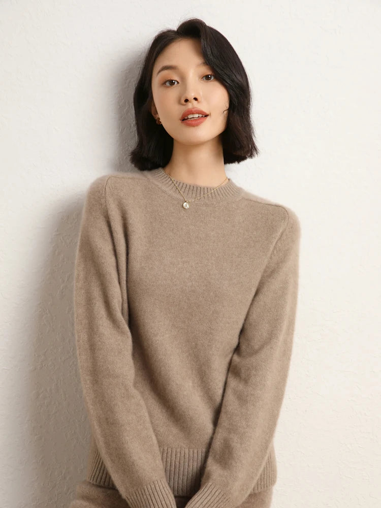Woman in Pale Taupe cashmere sweater with hands gently together – From Borcelleclothes.