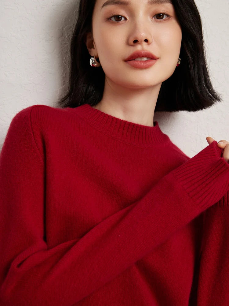 Woman in Red Devil cashmere sweater lightly touching fingers – From Borcelleclothes.