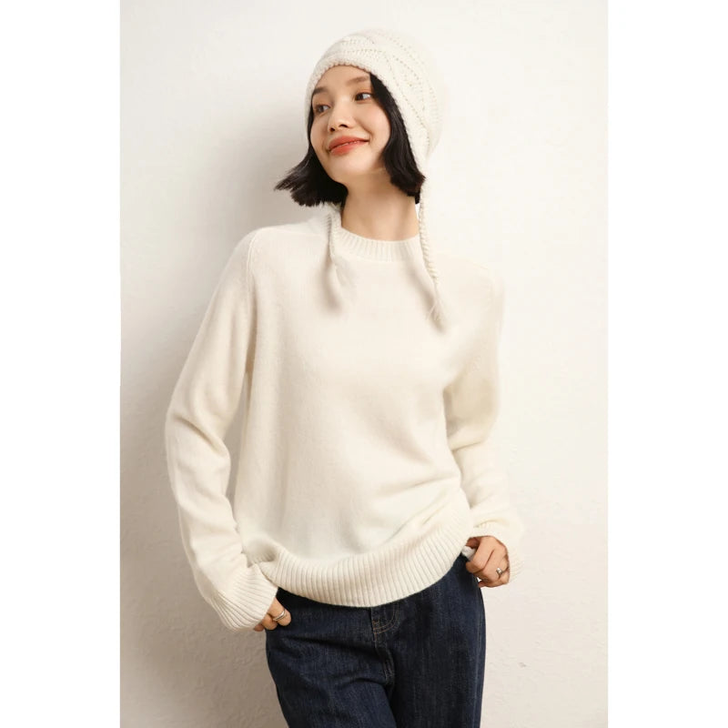 Women’s slim-fit sweater in 100% Alashan cashmere with saddle sleeves, ribbed crew neck, and 2x2 ribbed cuffs and hem, shown in White Chocolate color — From Borcelleclothes.