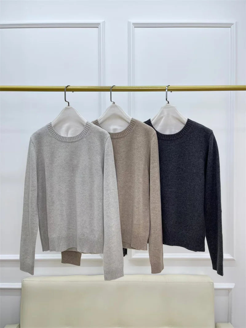 Women’s slim-fit cashmere sweaters with cuff detail in all available colors, displayed on hangers — From Borcelleclothes.