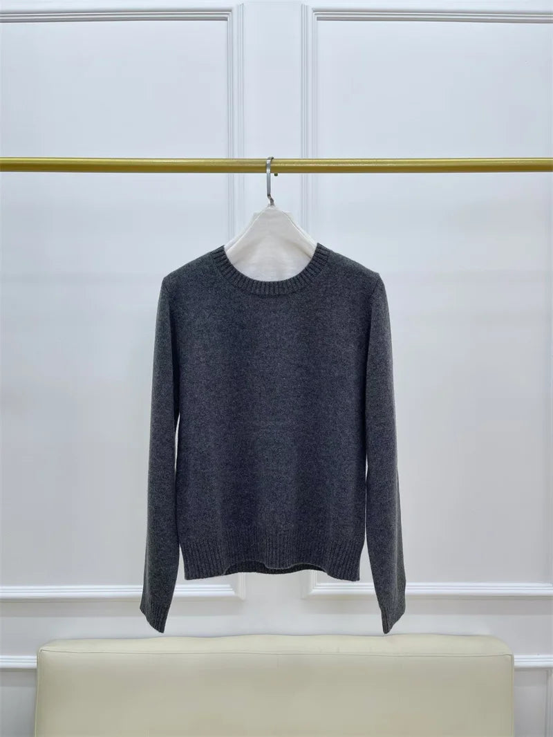 Women’s slim-fit cashmere sweater in Baltic Sea, with ribbed cuffs featuring subtle metal accents — From Borcelleclothes.