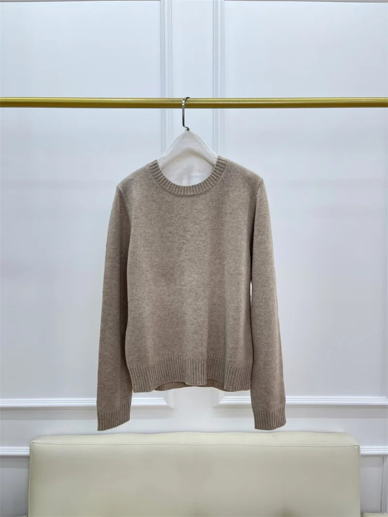 Women’s slim-fit cashmere sweater in Sandrift, with ribbed cuffs featuring subtle metal accents — From Borcelleclothes.