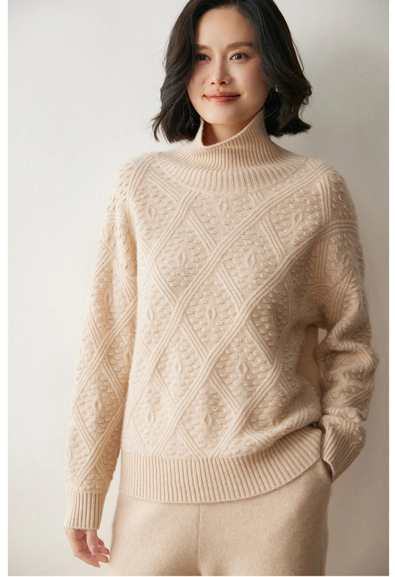 Model in Almond cashmere sweater with matching pants, hand placed casually in pocket — From Borcelleclothes.