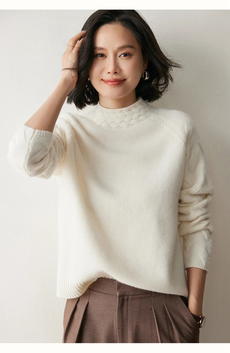 Model in White Coffee cashmere sweater adjusting hair — From Borcelleclothes.