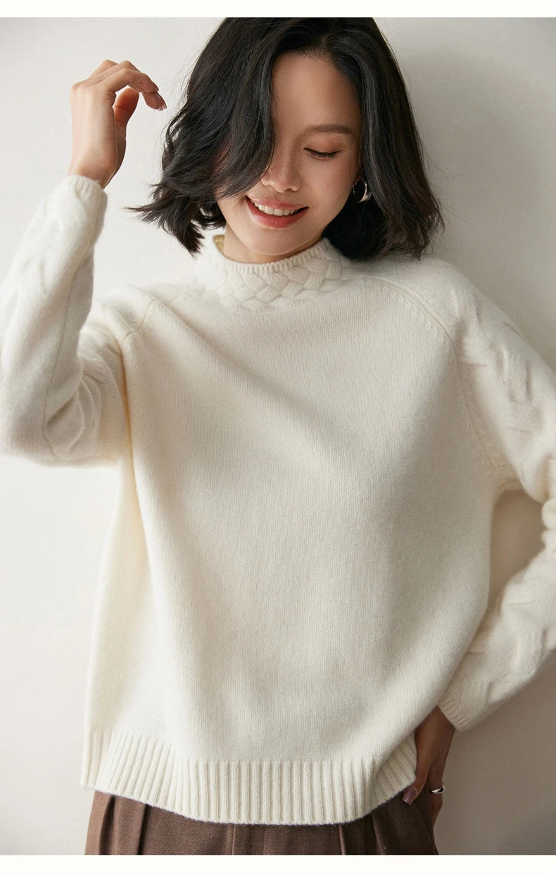 Model smiling with raised arm in White Coffee cashmere sweater — From Borcelleclothes.