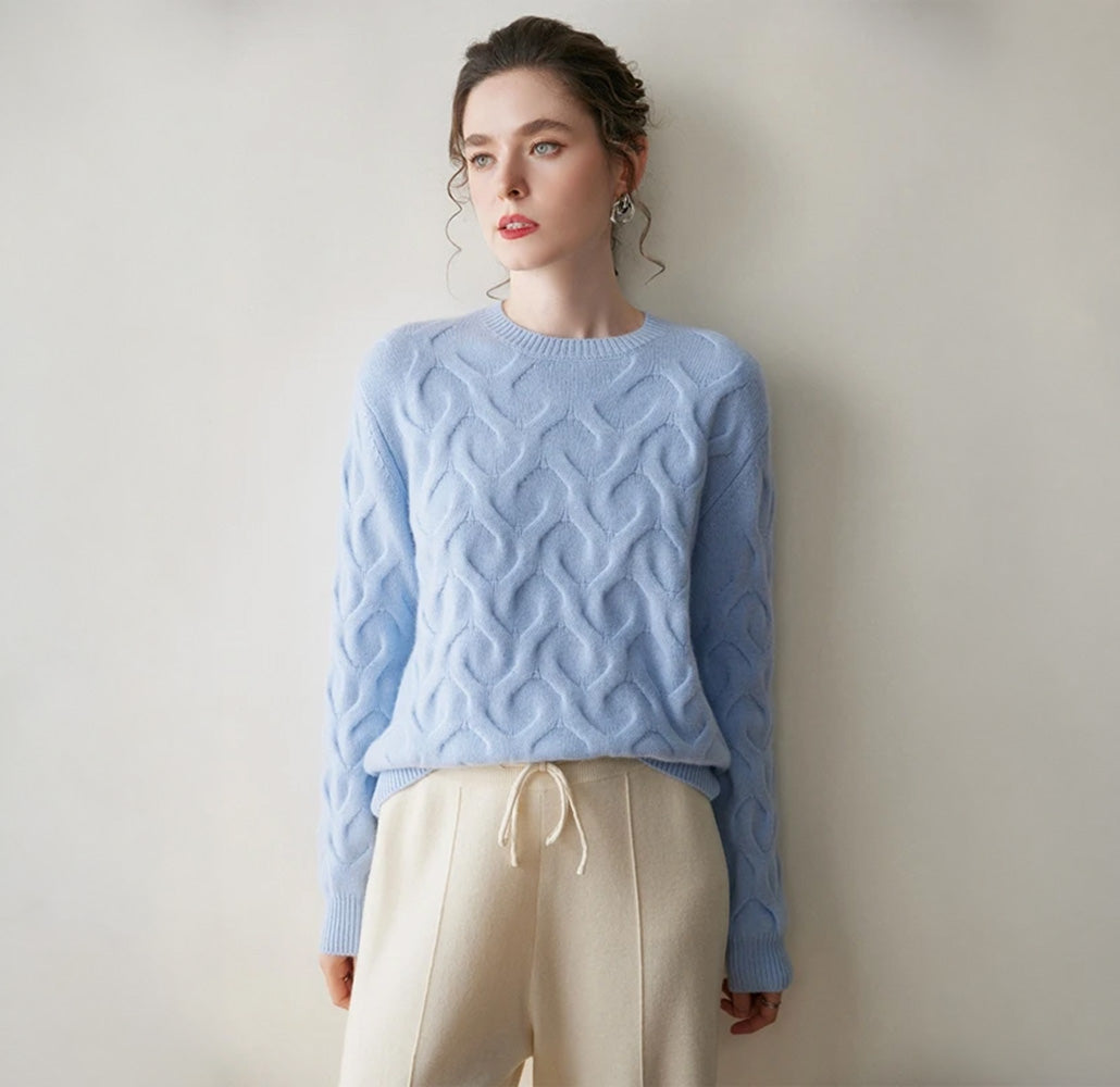 Women's Cashmere sweater in Forget Me Not color, with abstract heart relief, relaxed silhouette, crew neck, and ribbed finishes — available in four soft shades. From Borcelleclothes.