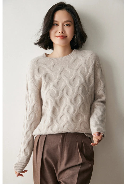 Model wearing the Silver Pink cashmere sweater with illusory hearts, styled with formal trousers — From Borcelleclothes.