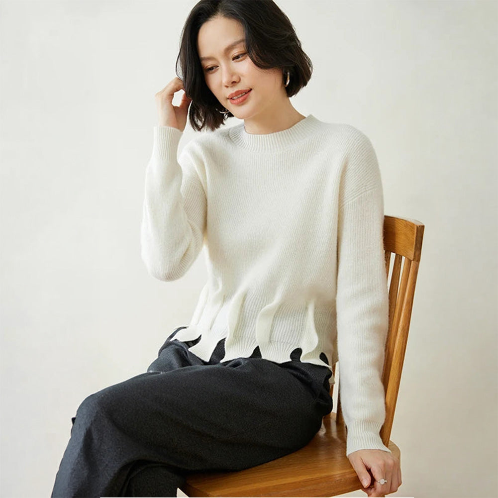 Women’s cashmere sweater in Pearl Bush, with staggered seam construction and sculptural flounces — From Borcelleclothes.