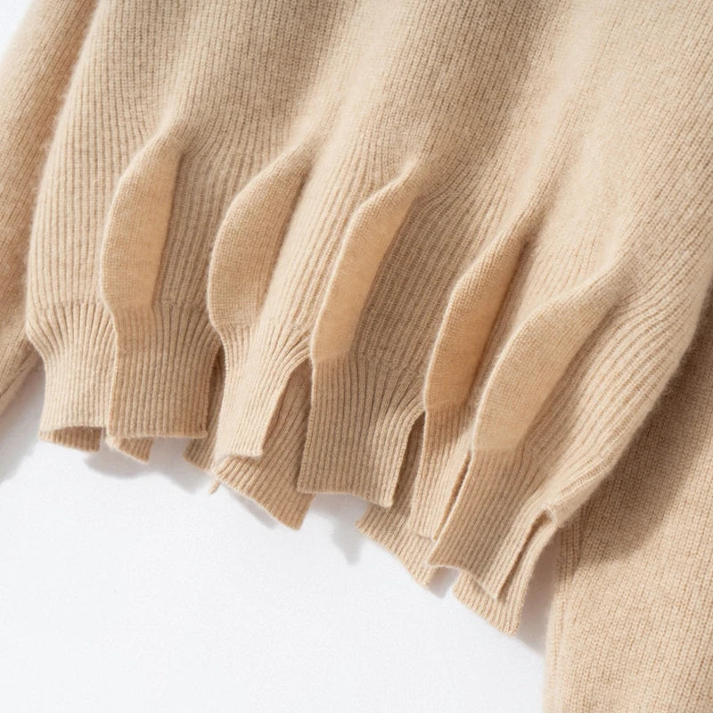 Bottom hem section of vanilla cashmere sweater with sculpted waistline – From Borcelleclothes.