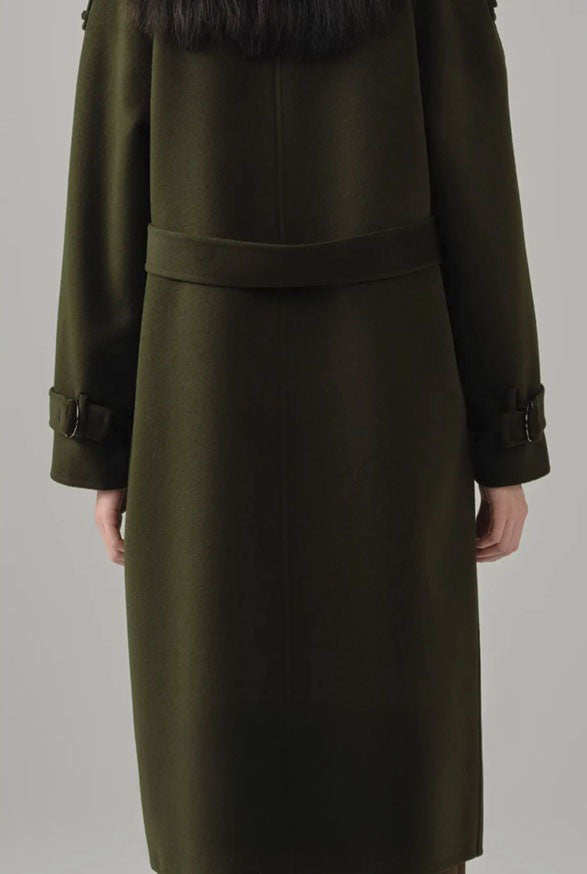 The Back of a women's cashmere trench coat in Birch, showcasing its tailored back design and adjustable waist belt. From Borcelleclothes.