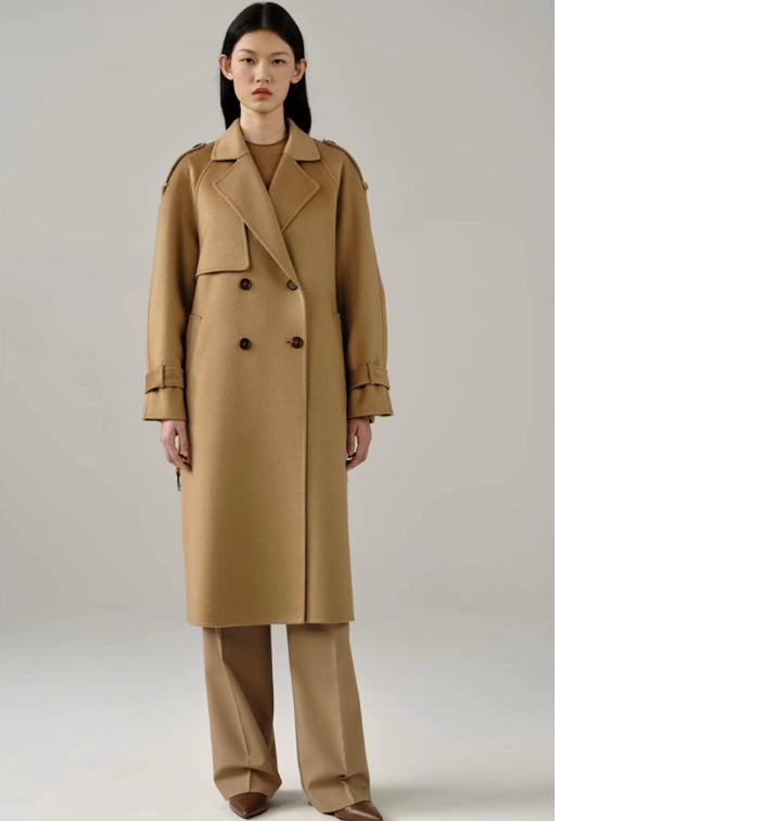 Model standing straight in the women's cashmere trench coat in Light Taupe, showcasing its classic military-inspired aesthetic. From Borcelleclothes.