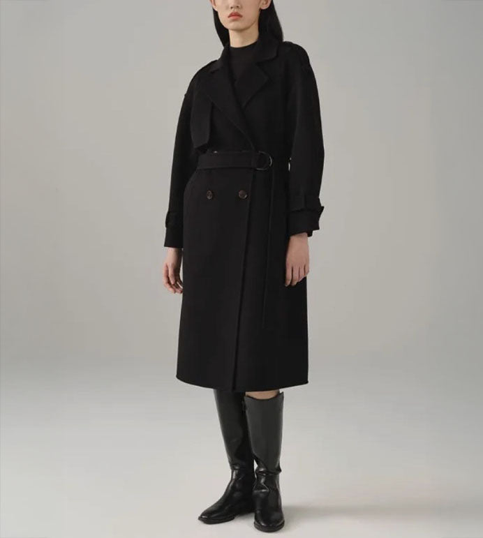 Women's Tibetan Cashmere Trench Coat in Onyx, featuring a luxurious military-inspired design with a single storm flap, adjustable sleeve tabs, and a belted waist for a refined, tailored silhouette. From Borcelleclothes.