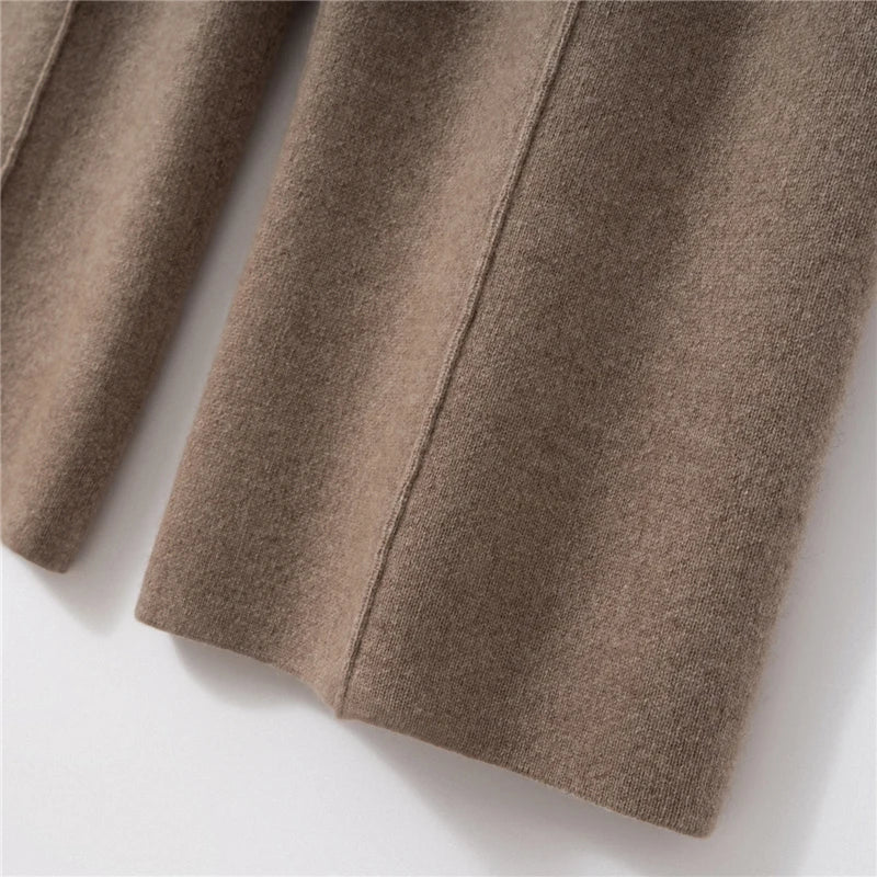Bottom hem detail of pastel brown cashmere trousers with tuck detail — From Borcelleclothes.